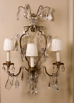 Pair of French, Late 19th Century, Crystal and Bronze Sconces Attributed to Bagues